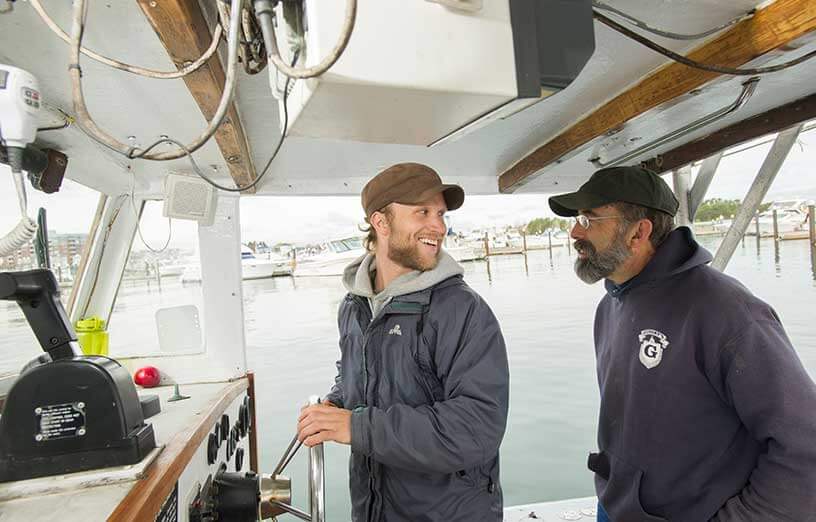 marine-science-instructors-on-boat