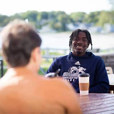 students-laughing-on-campus-SMCC-Maine