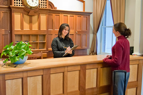 hotel-front-desk-manager-with-customer-SMCC-Maine