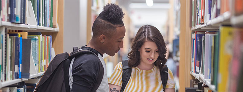 English-students-in-library-with-books