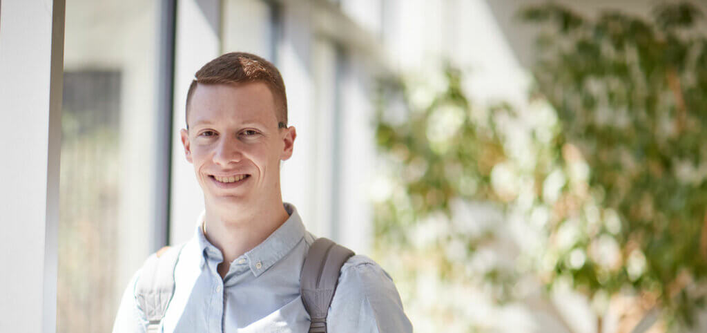 business-student-outside-on-campus-SMCC-Maine