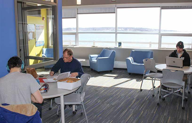 students-working-on-computer-in-studying-room