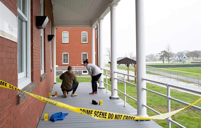 criminal-justice-students-on-campus-with-crime-scene-tape-SMCC-Maine