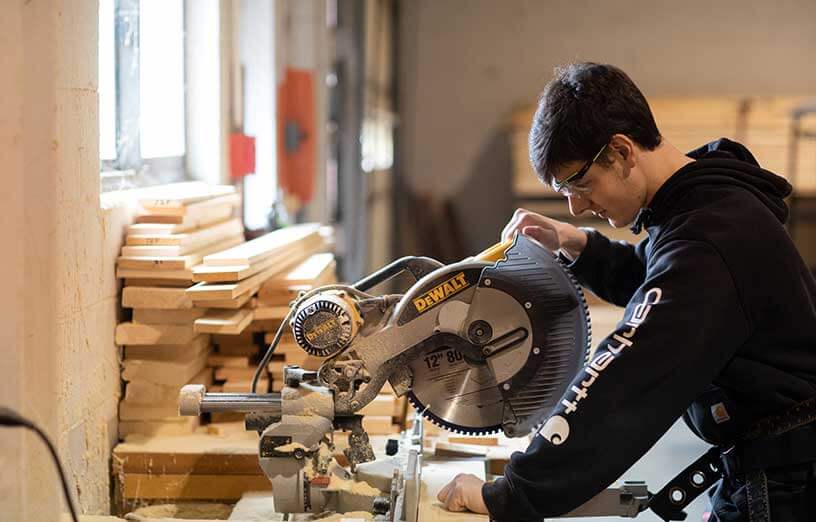 construction_technology_student_with_saw_SMCC_Maine