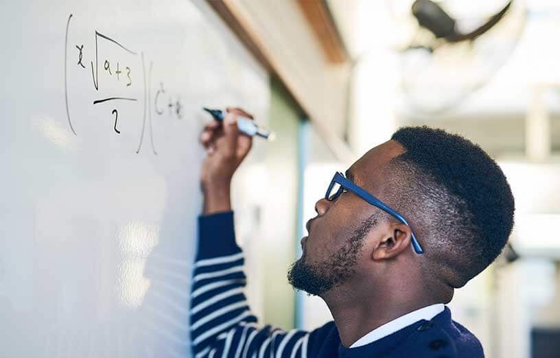 math-student-writing-equations-on-whiteboard