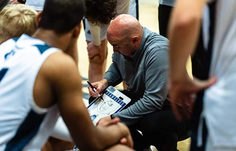 SMCC-maine-sport-team-coach-with-team-and-game-plan