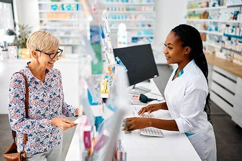 pharmacy-technician-working-with-customer