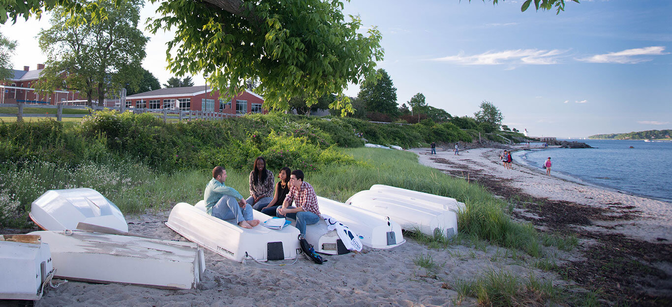 SMCC-students-sitting-at-beach-near-campus