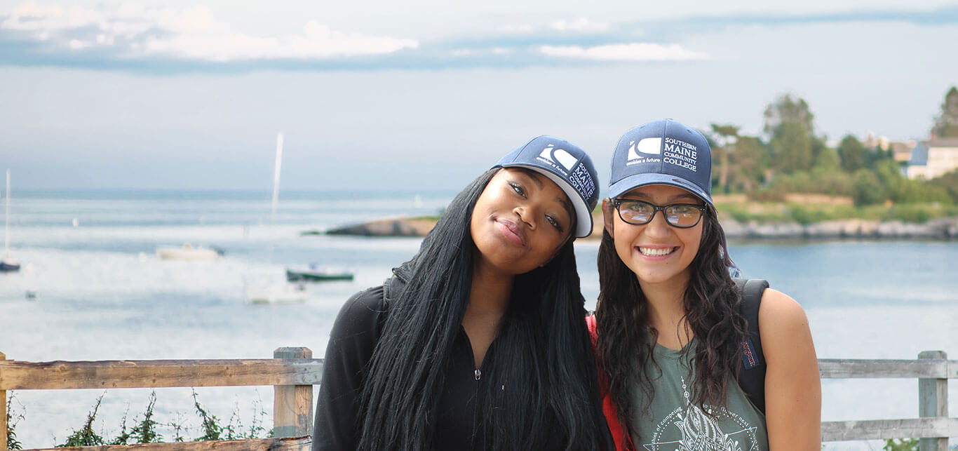 hello-smcc-two-students-by-the-ocean-with-smcc-hats